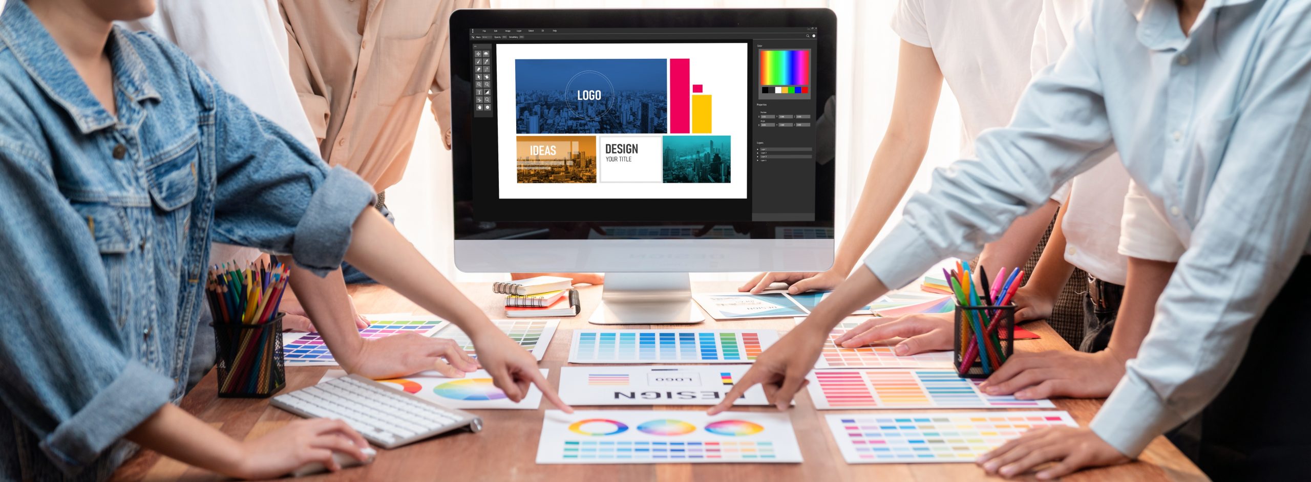 Graphic designer brainstorming logo and graphic arts at workshop. Scrutinize